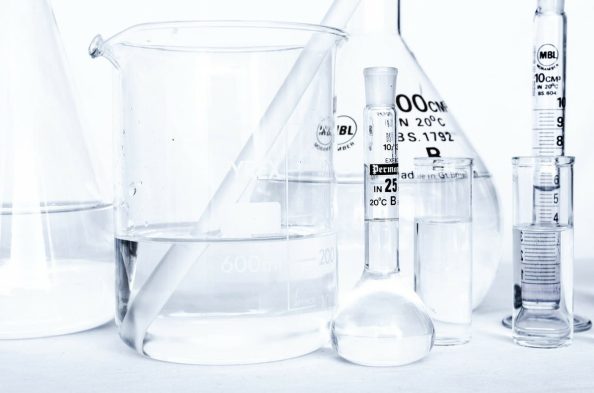 Laboratory with glass flasks filled with different liquids.