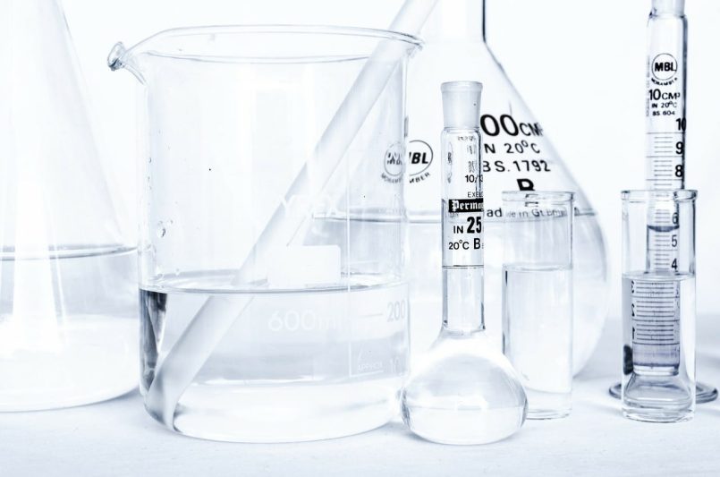 Laboratory with glass flasks filled with different liquids.