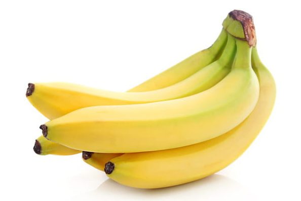 A bunch of bananas against a white background.