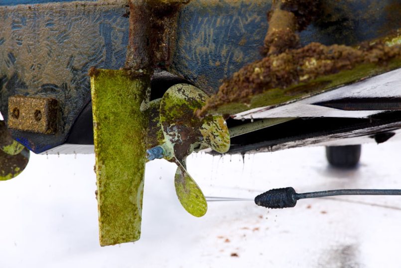 Ship's propeller with rust and green algae.