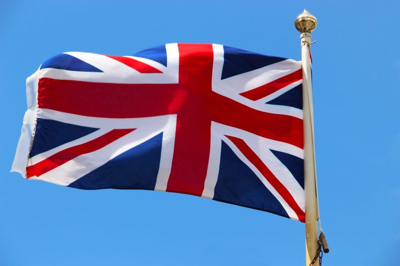 The Union Jack is flapping in the wind.