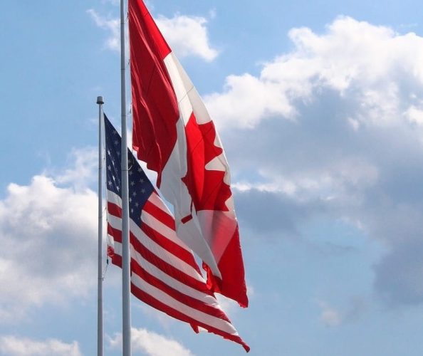 The flags of Canada and USA.