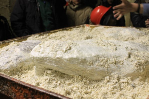 White stone with powder in a box.