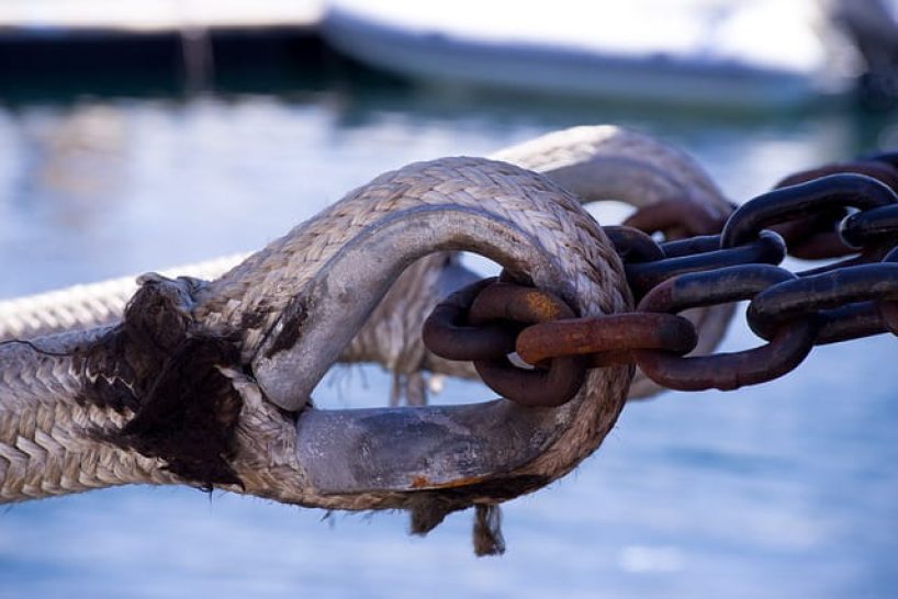 A rope with rusted stirrup.