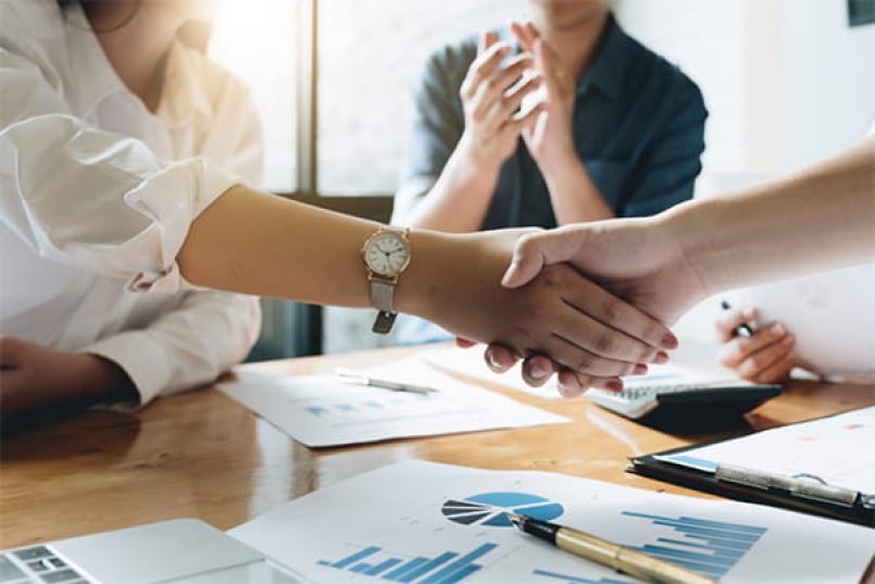 A handshake at a business meeting.