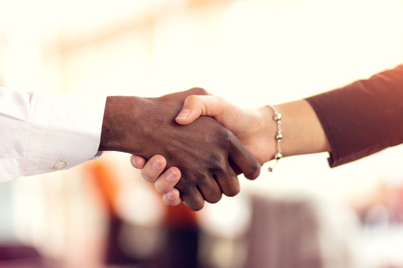 A handshake with a business background.