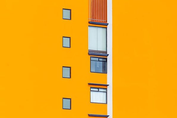 A yellow-orange painted facade as a symbolic image.