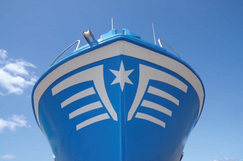 Blue painted hull with white stripes and a star in the middle.