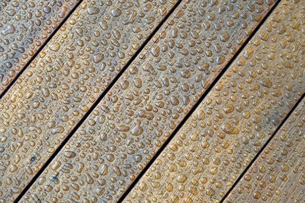 Wooden planks with water drops.