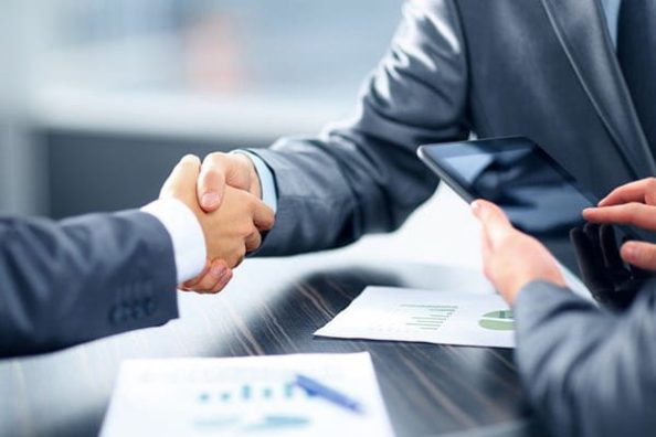 A handshake at a business meeting.