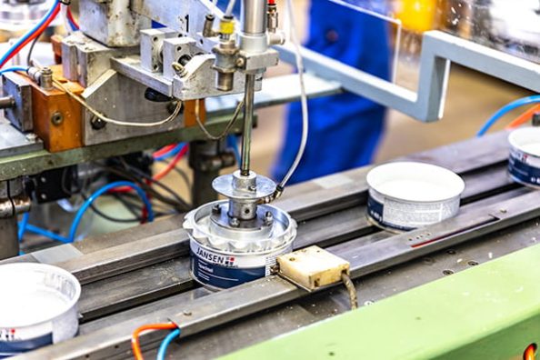 A can is filled with putty at the Jansen factory.