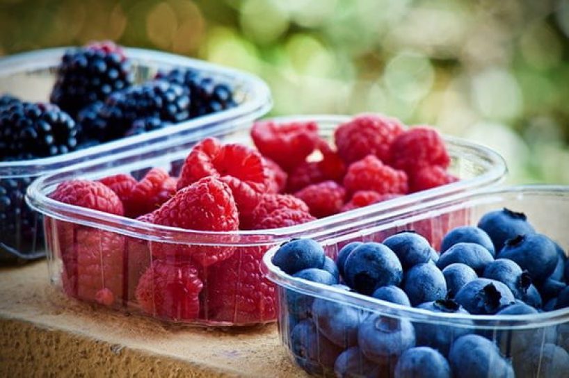 Various fruits in plastic bowls as a symbolic image.