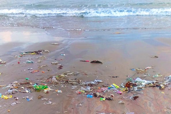 A beach polluted with plastic as a symbolic image.