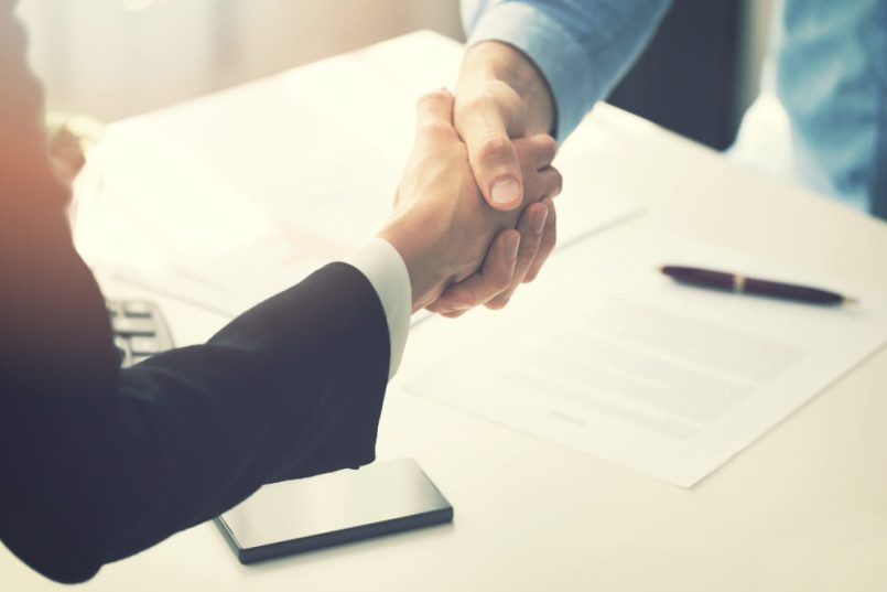 A handshake with a business background.