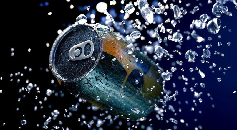 Beverage can surrounded by water drops.