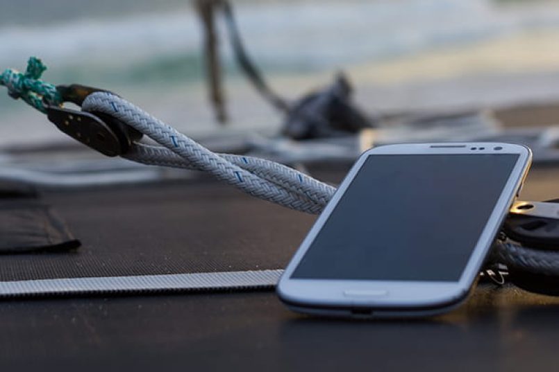 A smartphone lies on a boat