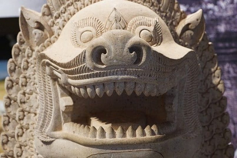 An ancient Chinese dragon sculpture as a symbolic image.