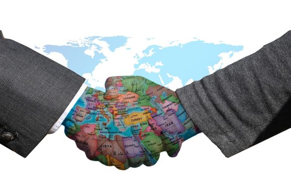 Symbol image: handshake with map and focus on Europe