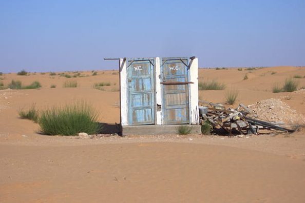 Free-standing toilet blocks in a desert environment.