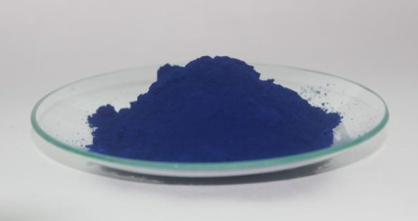 Blue pigments in a glass tray.